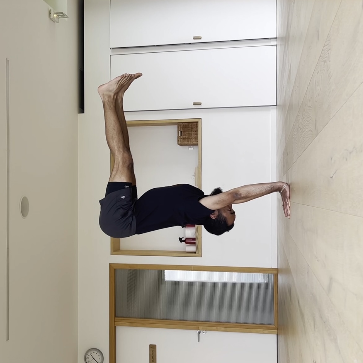 Advanced handstand yoga pose demonstration